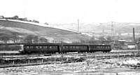 A 3 car Class 110 in original livery.  Leeds-Manchester train at Summit West in the snow on 28 December 1962. I Holt.